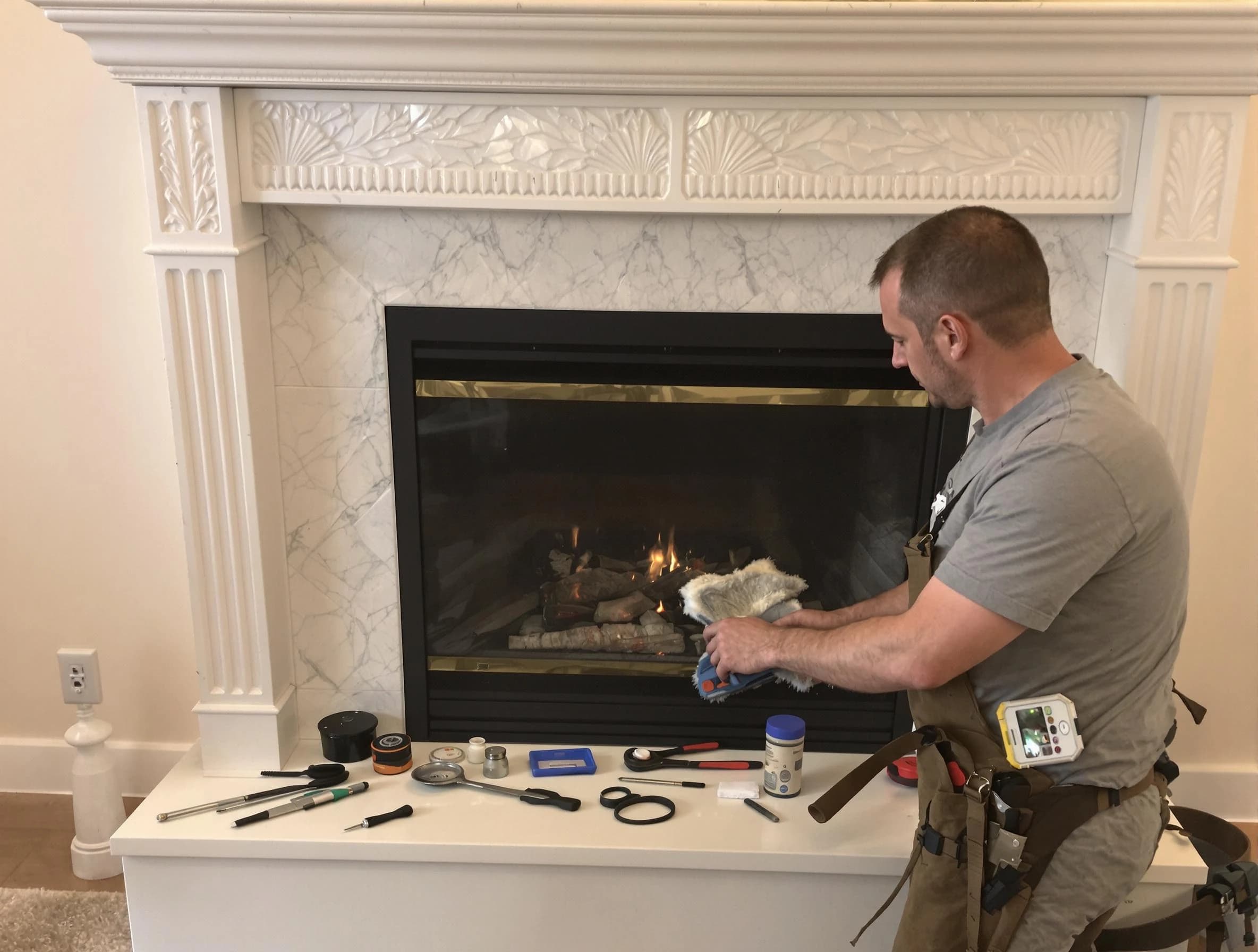 Lowell Chimney Sweep performing fireplace maintenance in Lowell, MA